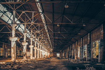 Abandoned industrial creepy warehouse inside old dark grunge factory building