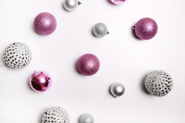 Christmas composition. Pink and silver decor on a white background. Flat lay, top view
