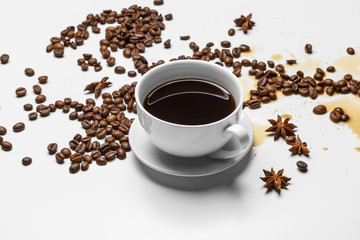 Coffee cup and beans on a white background