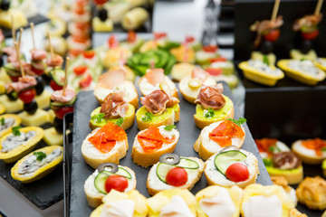 different types of catering canapes on buffet