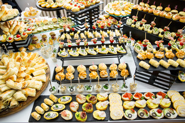 different types of catering canapes on buffet