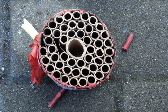 used round carton of fireworks with empty holes