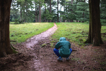 Child in distress seeks comfort in nature.