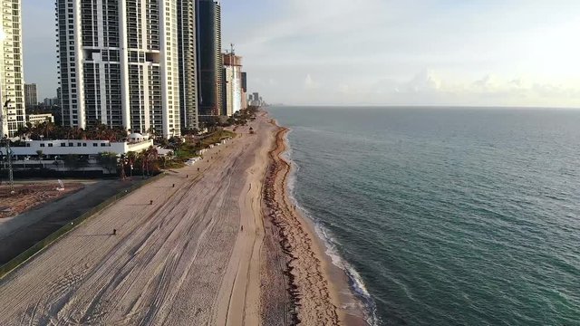 Aerial Drone shot above Sunny Isles Beach at time of sunrise, Florida