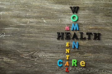 Composition with colorful letters on wooden background. Health care concept