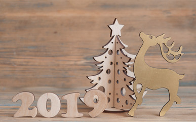 Christmas greeting card with ornaments on wooden background