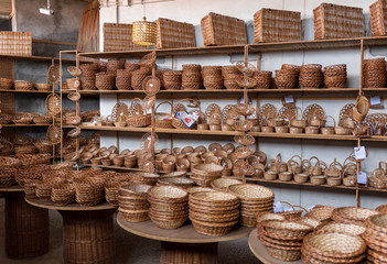 Wicker baskets on sale in a factory shop in Camacha on Madeira Island. Portugal - obrazy, fototapety, plakaty