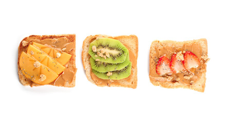 Different delicious toasts on white background