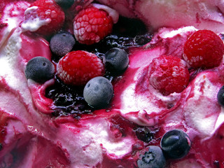 fresh raspberries and blueberries in icecream