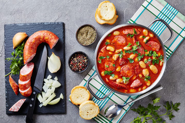 Stewed beans with sausages, herbs and spices