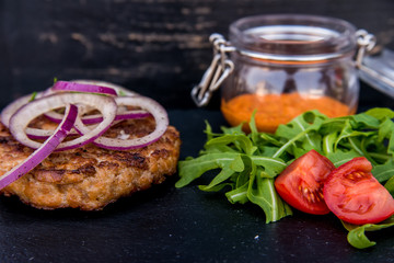 Grilled steak of chopped beef with vegetables