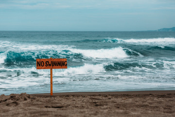 No swimming sign in surfing only waters in La Union, Philippines