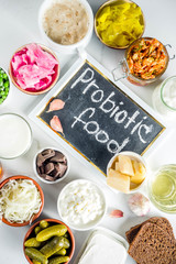 Super Healthy Probiotic Fermented Food Sources, drinks, ingredients, on white marble background...