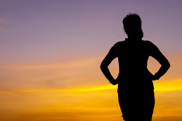 Young woman relaxing with sunset