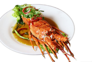 Cooked spiny lobster in white dish isolated