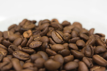 Fototapeta premium top view cup with coffee seeds and beans isolated on white backgorund. tasty morning drinks and beverages.