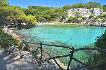 Turquoise water in bay Cala Macarella on Menorca island in Spain