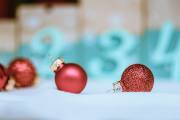 Red Christmas balls with decoration on shiny background