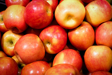 Red apple background, copy space for you design, top view.