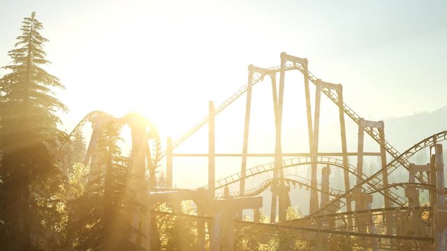 old roller coaster at sunset in forest