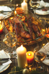 Roast duck. Thanksgiving table served with turkey, decorated with rosemary and pomegranate seeds and candles. Roast duck, table. Christmas dinner, Flat lay
