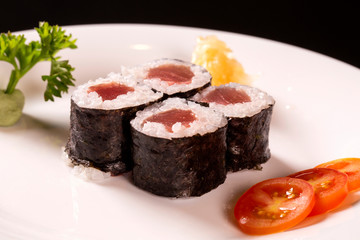 Sushi plate on black background