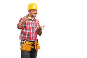 Constructor pointing at camera with asking gesture.
