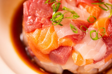 A delicious tartare of fresh Mediterranean tuna, salmon and white fish. Seasoned with extra virgin olive oil, chives, parsley and a drops of orange juice