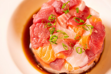 A delicious tartare of fresh Mediterranean tuna, salmon and white fish. Seasoned with extra virgin olive oil, chives, parsley and a drops of orange juice