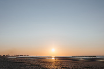Ocean view at sunset over the sand dunes on the North sea.