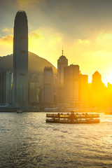 The Boat on Victoria harbour with sunset at Hong Kong.