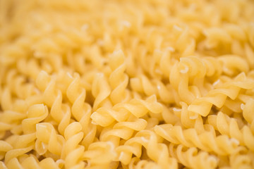 raw fusilli pasta macro