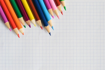 colorful pencils lie on a  paper