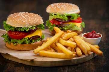 Burger with French fries cutlet with cheese and tomato