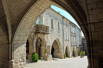 Obraz premium The 'Place des Arcades', central square in Monflanquin, Lot-et-Garonne, France. 