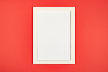 Empty picture frame on textured pastel colored background