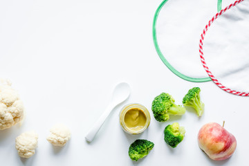 cooking vegetable puree for baby on white background top view