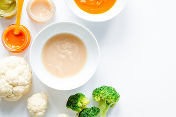 cooking vegetable puree for baby on white background top view