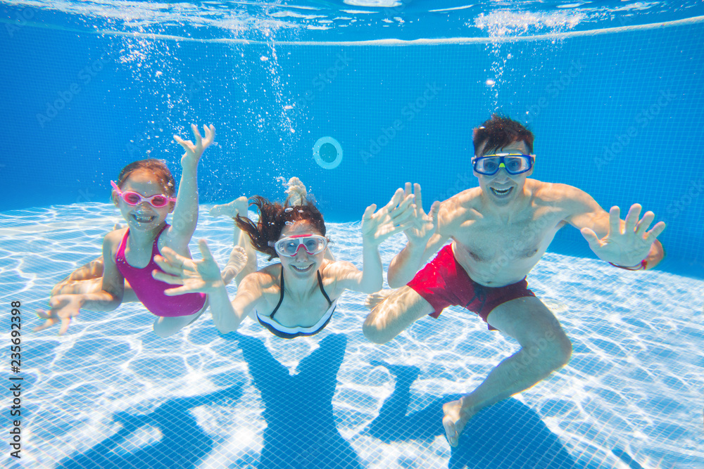 Wall mural family  in swimming pool