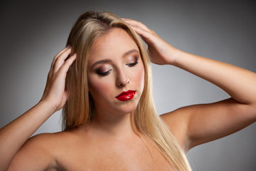 Fototapeta premium Beauty portrait of a cute blonde caucasian woman with green eyes