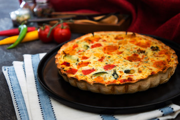VEGETABLE PIE WITH CHERRY TOMATOES, GRILLED PEPPERS AND COURGETTES With fresh eggs and fresh cream