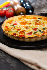 VEGETABLE PIE WITH CHERRY TOMATOES, GRILLED PEPPERS AND COURGETTES With fresh eggs and fresh cream