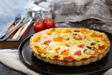 VEGETABLE PIE WITH CHERRY TOMATOES, GRILLED PEPPERS AND COURGETTES With fresh eggs and fresh cream