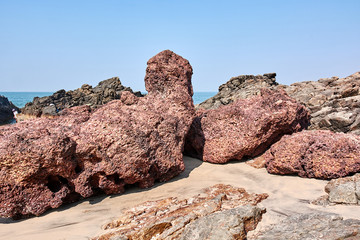 Fototapeta na wymiar India. Goa State. Stone heaps on the beach Kerem