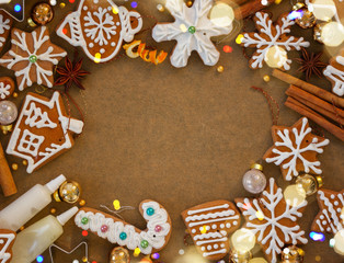 christmas frame with gingerbread baked cookies and spices on cooking paper