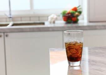 sparkling water in a glass put on the counter in house