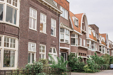 Fototapeta na wymiar Beautiful brick facade of the Dutch building. Local architecture in Groningen, The Netherlands.