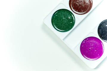 a case with paint on a table