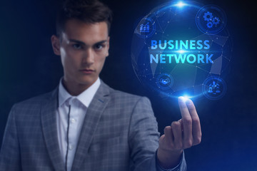 The concept of business, technology, the Internet and the network. A young entrepreneur working on a virtual screen of the future and sees the inscription: business network
