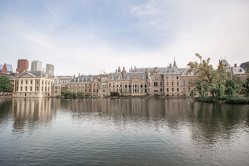 Fototapeta premium Amazing Binnenhof Palace in The Hague (Den Haag). Dutch Parliament buildings. Famous castle with fountains in front of it. The Netherlands, The Hague. 